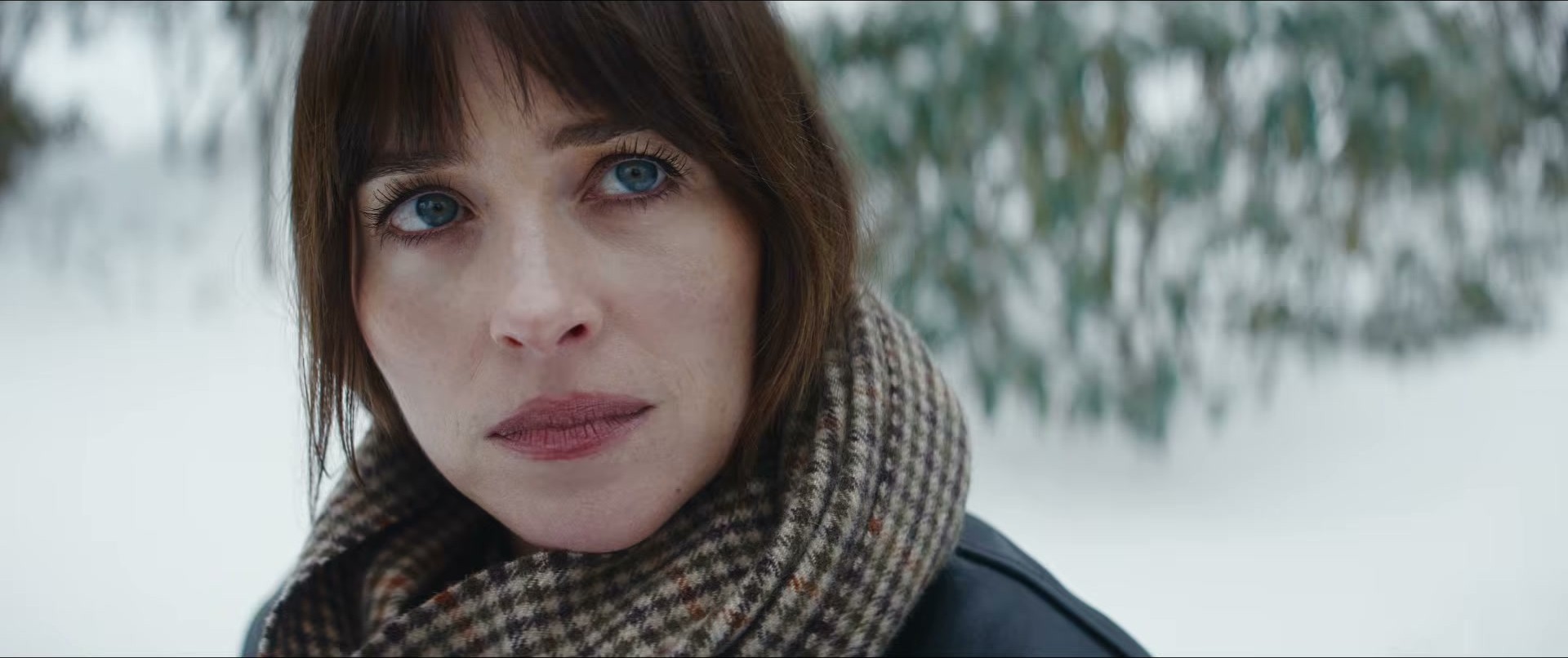 Dakota Johnson in Verity — scarf game strong in this shot