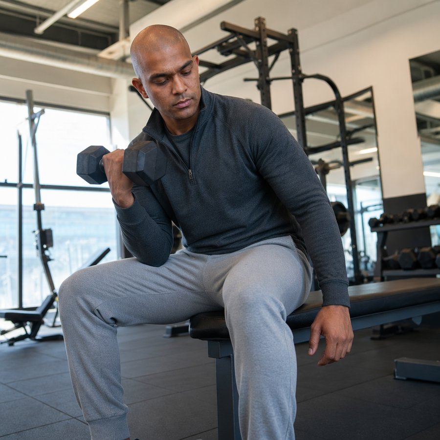dark quarter zip grounds the light grey sweats