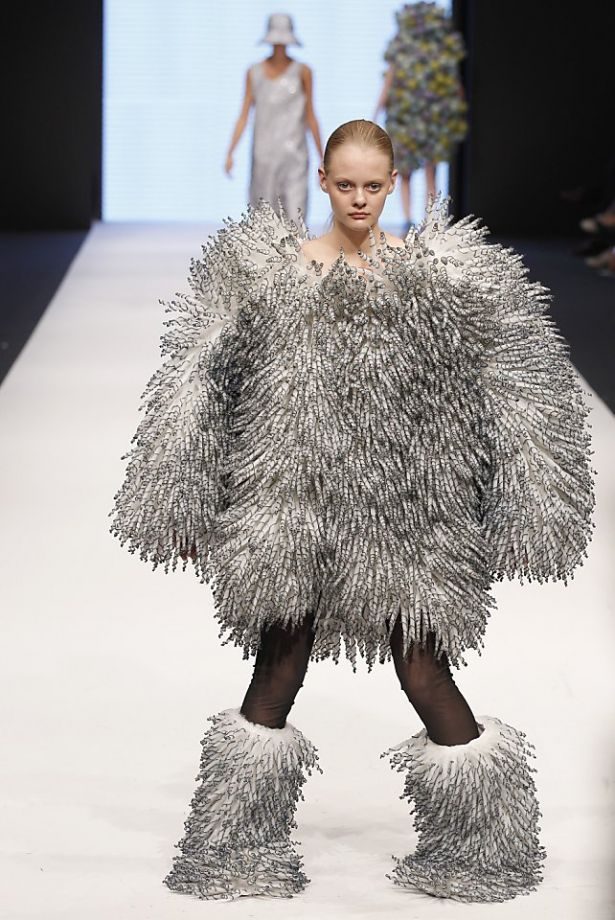 This shaggy silver coat owns the runway