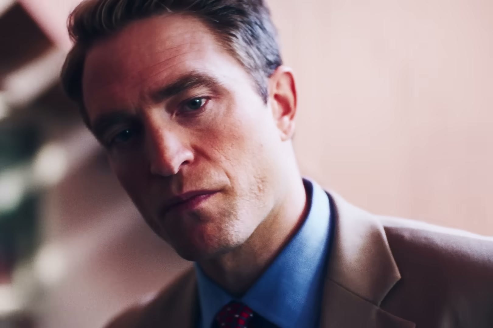 Robert Pattinson in Primetime — tan blazer and blue shirt duo