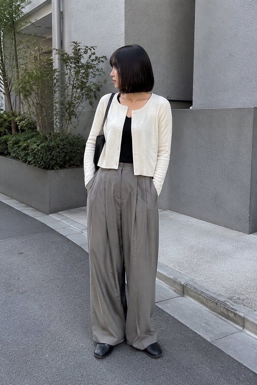 trousers dragging slightly on the concrete