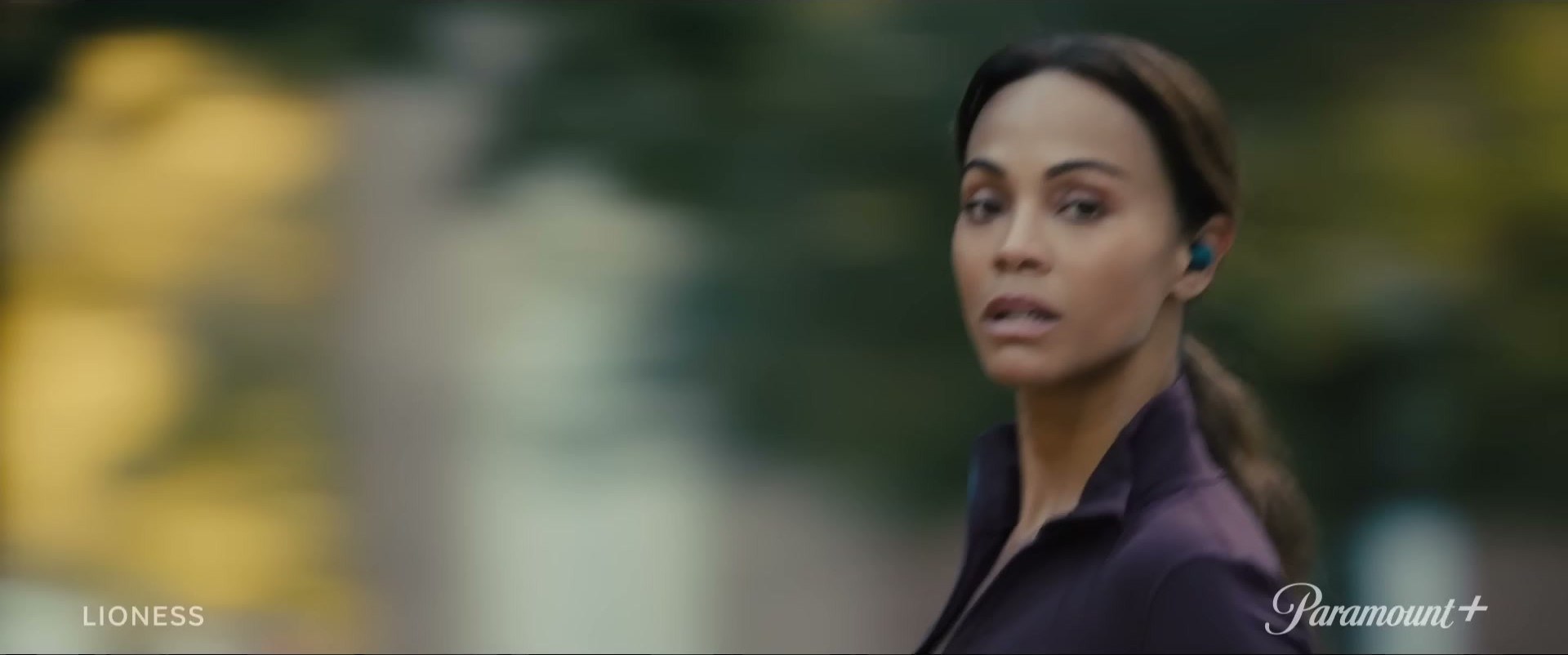 Zoe Saldaña in Lioness on Paramount+ — plum is the ultimate power color
