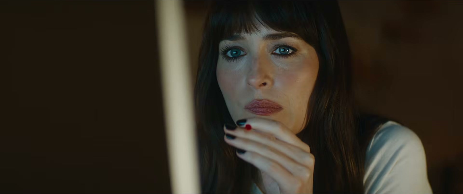 Dakota Johnson in Verity — simple white tee fits the moody vibe perfectly