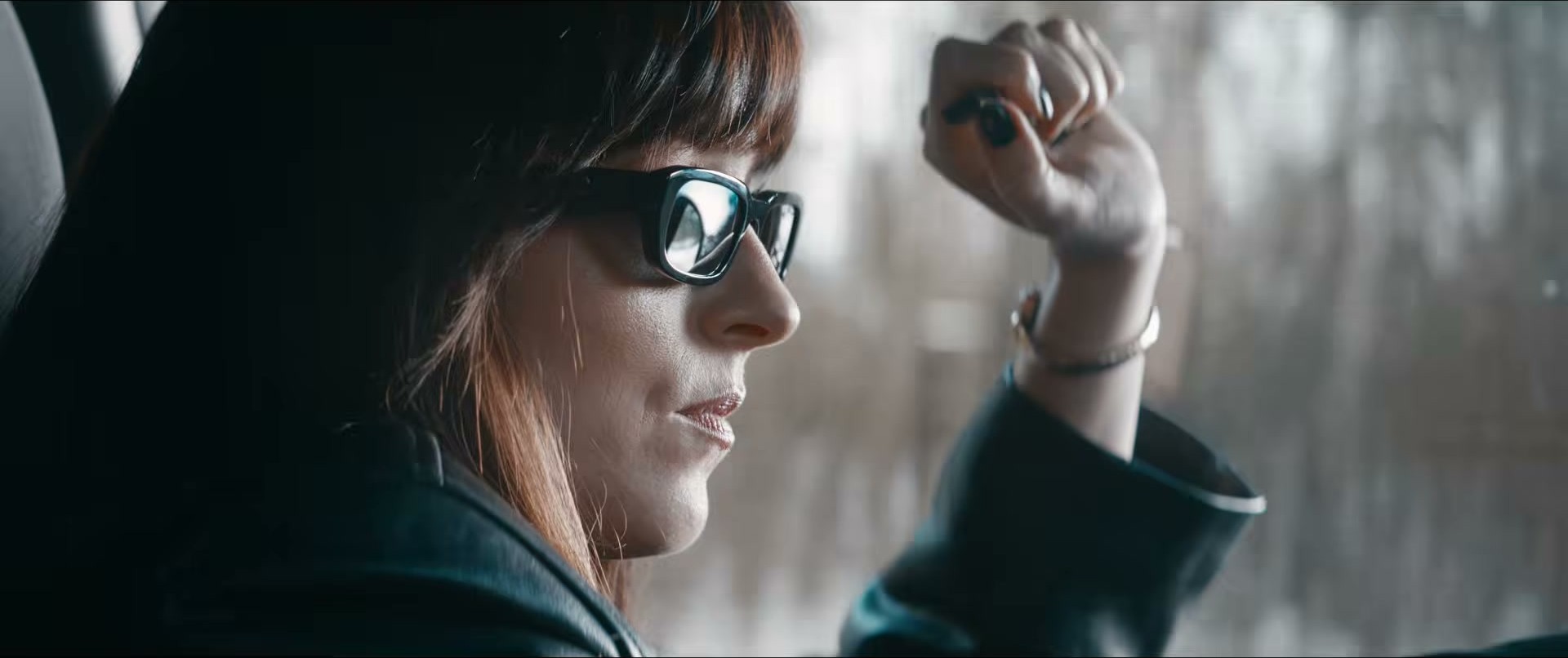 Dakota Johnson in Verity — sunglasses are doing all the work here