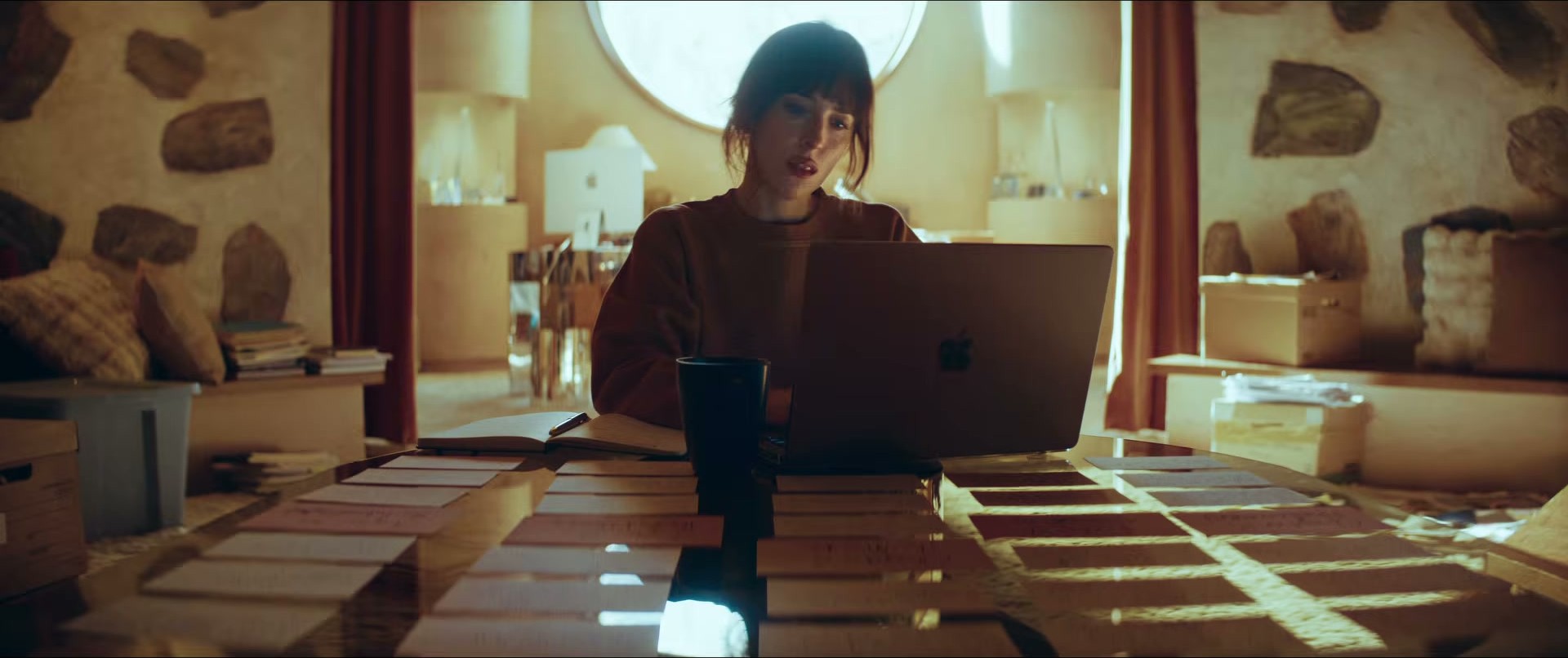 Dakota Johnson in Verity — cozy writer vibes in burnt orange